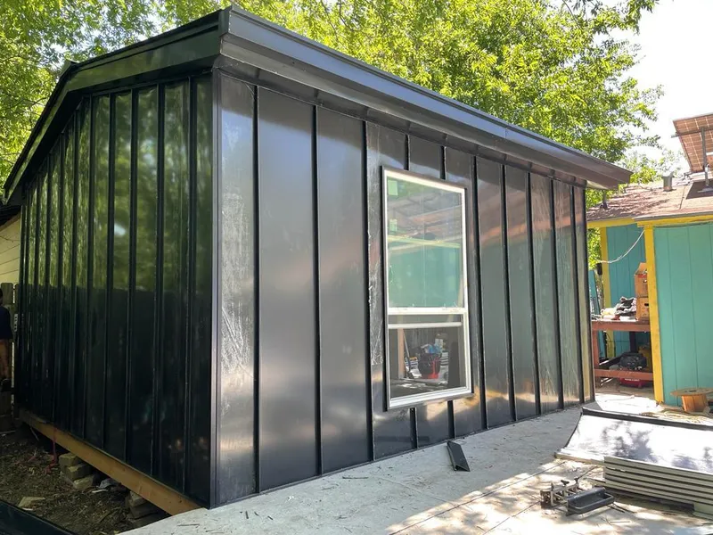 Black standing seam metal wall panels for Roof Inspection in Chanute