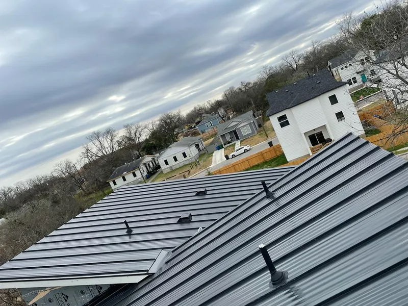 Standing seam metal roof panels with vents for Skylight Repair in Chanute